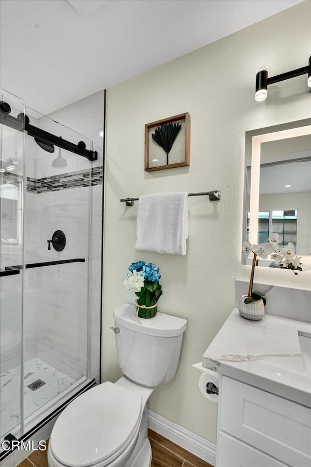 17632 E Covina Blvd, Covina, CA 91722 - bathroom featuring a stall shower, vanity, and wood finished floors