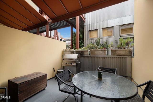 view of patio / terrace featuring area for grilling and outdoor dining area