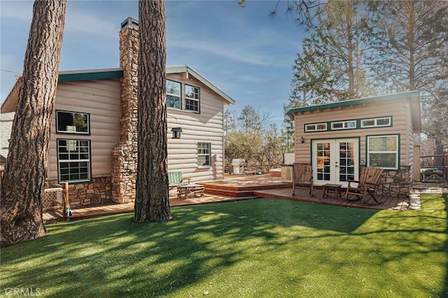 879 Orange Ave, Sugarloaf, CA 92386 - rear view of property featuring a chimney, a yard, french doors, and a wooden deck