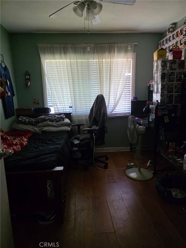 bedroom with hardwood / wood-style floors and ceiling fan
