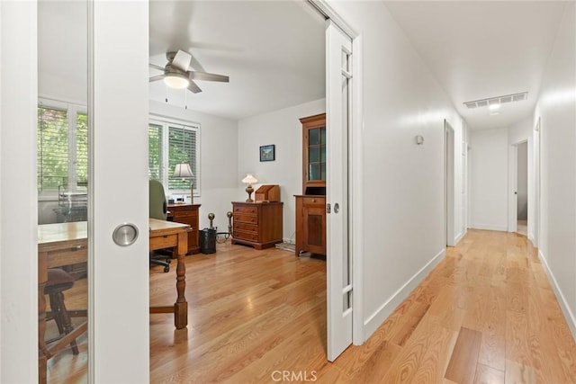 1273 E 7th St, Chico, CA 95928 - corridor featuring light wood-style floors, an office area, and baseboards