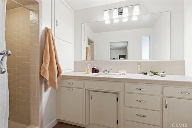 1273 E 7th St, Chico, CA 95928 - full bathroom with tiled shower, backsplash, and vanity