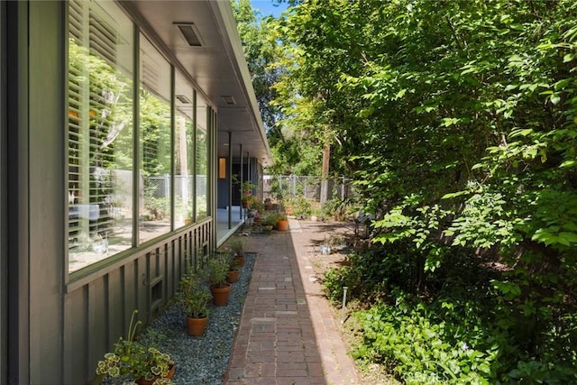 1273 E 7th St, Chico, CA 95928 - view of home's exterior with board and batten siding and fence