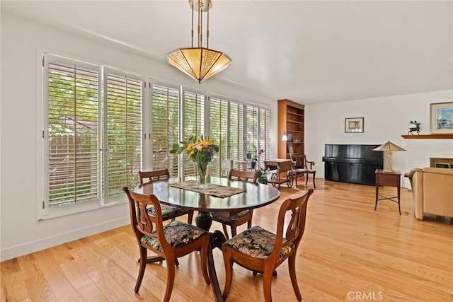 1273 E 7th St, Chico, CA 95928 - dining room featuring plenty of natural light, light wood finished floors, and baseboards