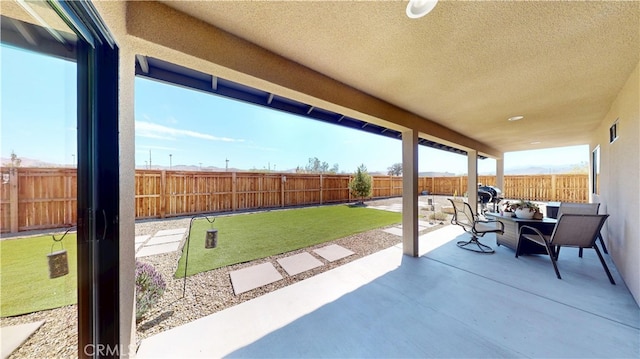 view of patio with visible vents and a fenced backyard
