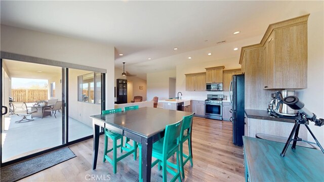 dining space with visible vents, light wood-type flooring, and recessed lighting