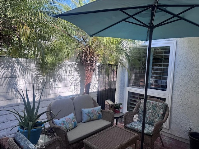 view of patio / terrace featuring fence