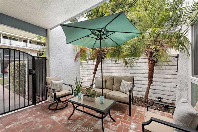 964 Calle Aragon Unit D, Laguna Woods, CA 92637 - view of patio with an outdoor living space and fence