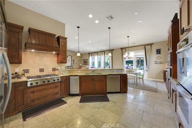 5660 Stoneview Rd, Rancho Cucamonga, CA 91739 - kitchen with stainless steel appliances, visible vents, decorative backsplash, and a peninsula