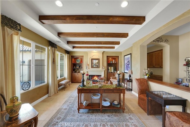 5660 Stoneview Rd, Rancho Cucamonga, CA 91739 - office with beamed ceiling, a warm lit fireplace, light tile patterned floors, and arched walkways