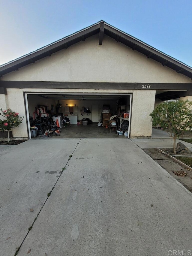 garage featuring driveway
