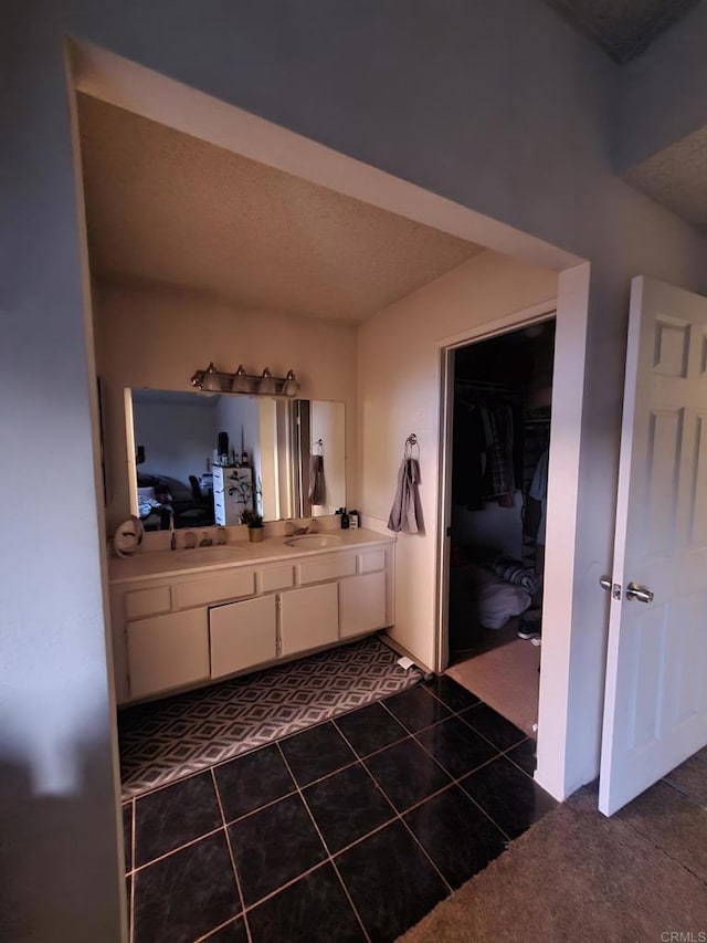 bathroom featuring tile patterned floors and vanity