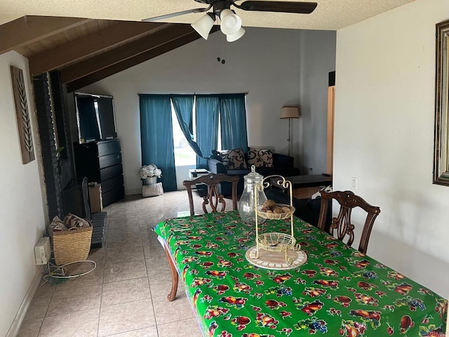 tiled dining room with lofted ceiling and a ceiling fan
