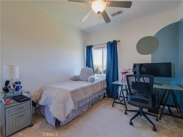 bedroom with carpet flooring, visible vents, and ceiling fan