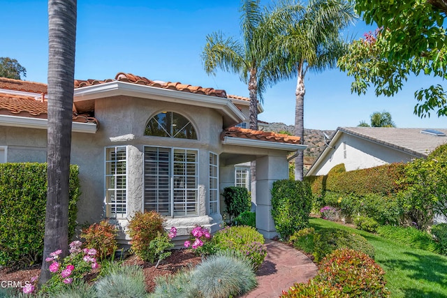 1480 Forest Knoll Dr, Oak Park, CA 91377 - view of front facade with stucco siding and a tile roof