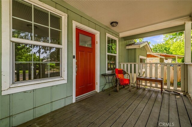 wooden deck featuring covered porch