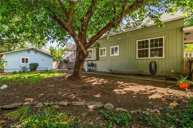 back of property featuring fence