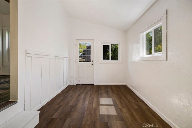 1617 Hemlock St, Chico, CA 95928 - doorway featuring vaulted ceiling, dark wood-type flooring, and baseboards