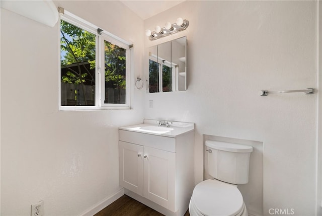 1617 Hemlock St, Chico, CA 95928 - bathroom featuring vanity, toilet, baseboards, and wood finished floors