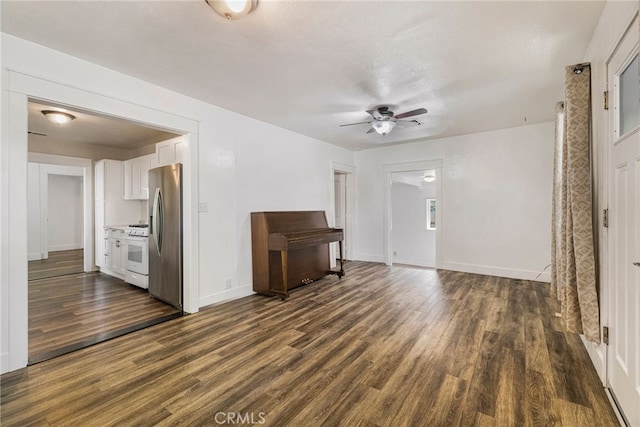1617 Hemlock St, Chico, CA 95928 - unfurnished living room featuring a ceiling fan, dark wood-style flooring, and baseboards