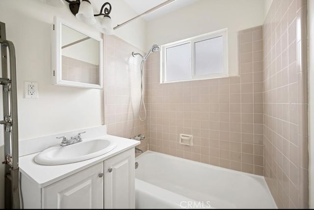 full bathroom featuring washtub / shower combination and vanity
