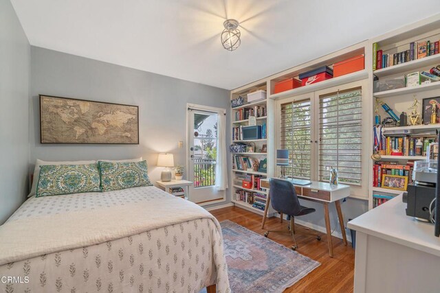 bedroom featuring wood finished floors