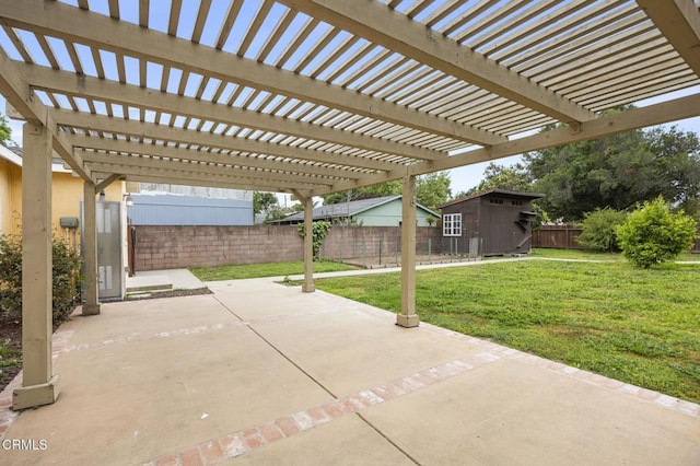 view of patio / terrace featuring an outdoor structure, a fenced backyard, and a storage shed