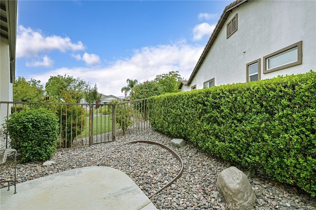 view of yard featuring a patio area and fence