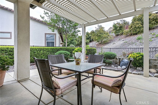 view of patio / terrace featuring outdoor dining area, a fenced backyard, and a pergola