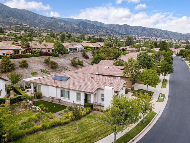 drone / aerial view featuring a mountain view and a residential view