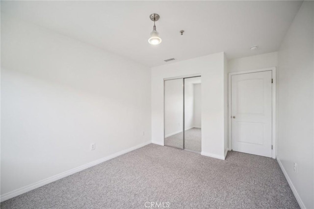 14618 Gilmore St Unit 8, Van Nuys, CA 91411 - unfurnished bedroom with visible vents, baseboards, carpet flooring, and a closet