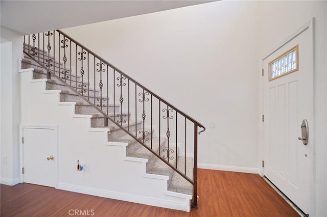 14618 Gilmore St Unit 8, Van Nuys, CA 91411 - entryway with stairs, wood finished floors, and baseboards
