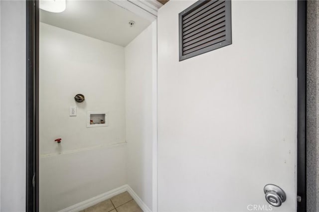 14618 Gilmore St Unit 8, Van Nuys, CA 91411 - laundry area with washer hookup, visible vents, baseboards, light tile patterned flooring, and laundry area