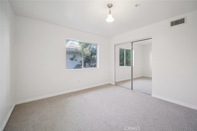 14618 Gilmore St Unit 8, Van Nuys, CA 91411 - unfurnished bedroom featuring a closet, visible vents, carpet floors, and baseboards