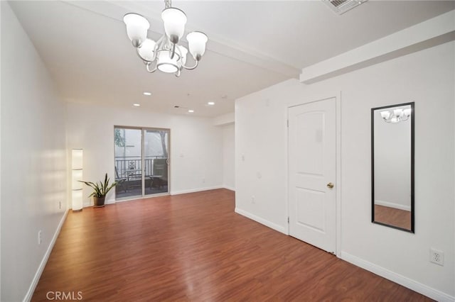 14618 Gilmore St Unit 8, Van Nuys, CA 91411 - empty room featuring baseboards, visible vents, wood finished floors, and a notable chandelier