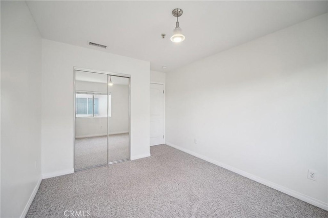 14618 Gilmore St Unit 8, Van Nuys, CA 91411 - unfurnished bedroom featuring visible vents, a closet, baseboards, and carpet floors