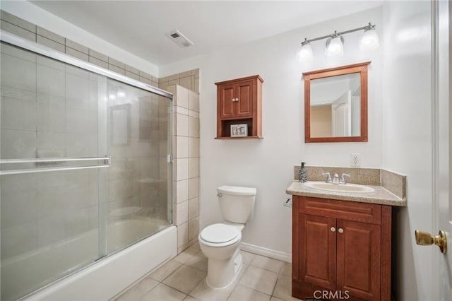 14618 Gilmore St Unit 8, Van Nuys, CA 91411 - full bath with visible vents, enclosed tub / shower combo, toilet, vanity, and tile patterned flooring