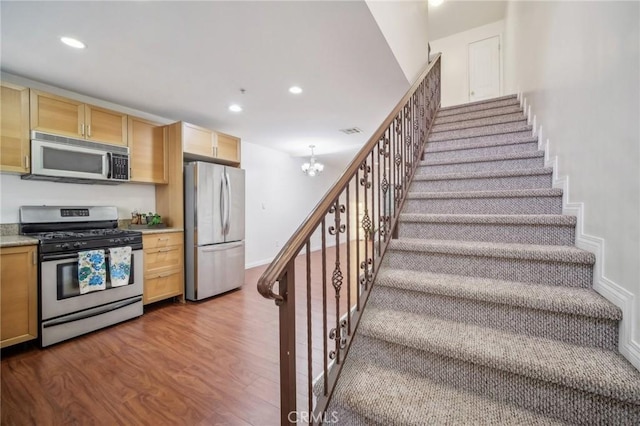 14618 Gilmore St Unit 8, Van Nuys, CA 91411 - kitchen featuring recessed lighting, a chandelier, stainless steel appliances, dark wood-type flooring, and visible vents