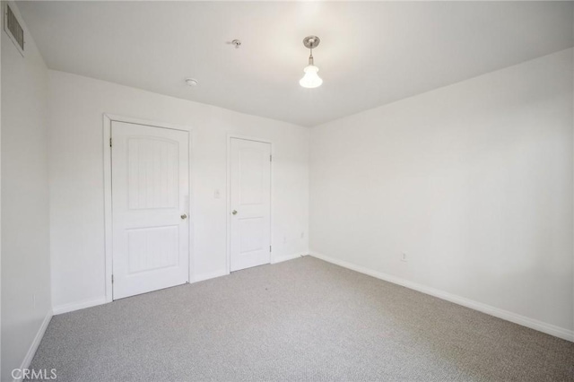 14618 Gilmore St Unit 8, Van Nuys, CA 91411 - unfurnished bedroom featuring baseboards, visible vents, and carpet flooring