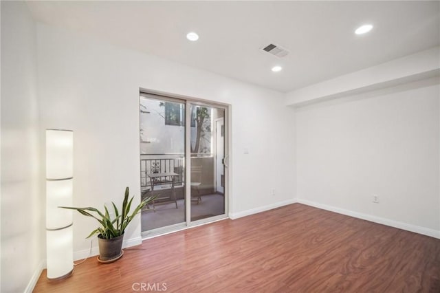 14618 Gilmore St Unit 8, Van Nuys, CA 91411 - empty room featuring wood finished floors, visible vents, and recessed lighting