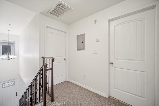 14618 Gilmore St Unit 8, Van Nuys, CA 91411 - corridor featuring an inviting chandelier, an upstairs landing, electric panel, visible vents, and carpet
