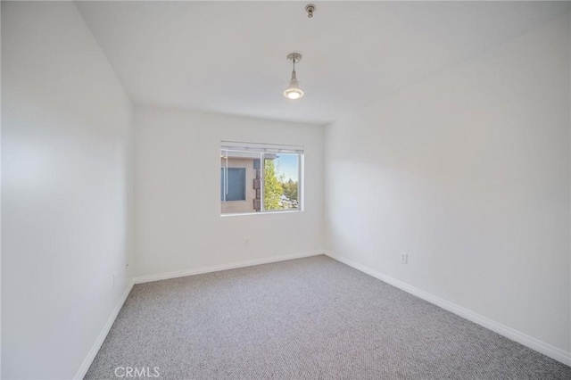 14618 Gilmore St Unit 8, Van Nuys, CA 91411 - carpeted spare room featuring baseboards