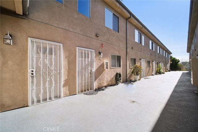14618 Gilmore St Unit 8, Van Nuys, CA 91411 - exterior space with stucco siding and a patio area