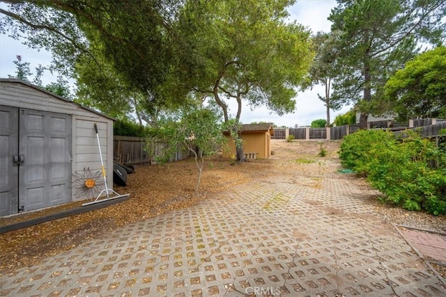 259 Saint Andrews Way, Lompoc, CA 93436 - fenced backyard with a storage shed and a patio