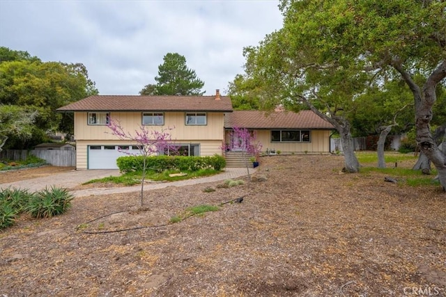 259 Saint Andrews Way, Lompoc, CA 93436 - view of front of home with driveway, an attached garage, and a chimney
