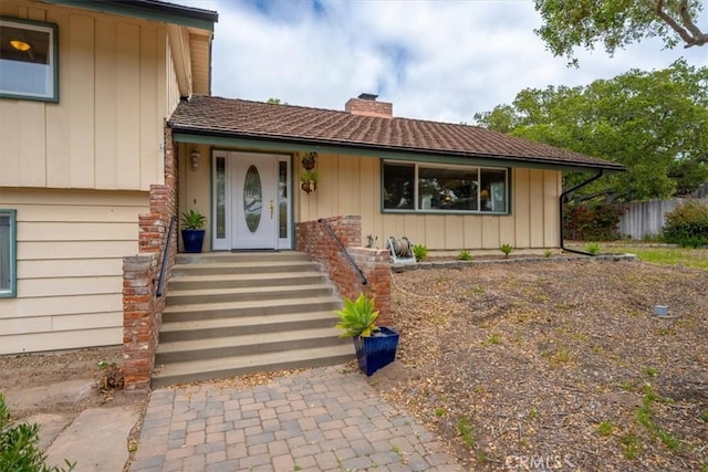 259 Saint Andrews Way, Lompoc, CA 93436 - view of front of property with a chimney and board and batten siding