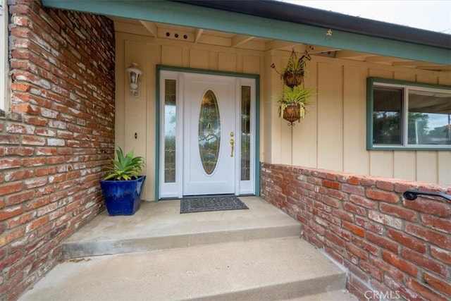 259 Saint Andrews Way, Lompoc, CA 93436 - view of exterior entry with brick siding and board and batten siding