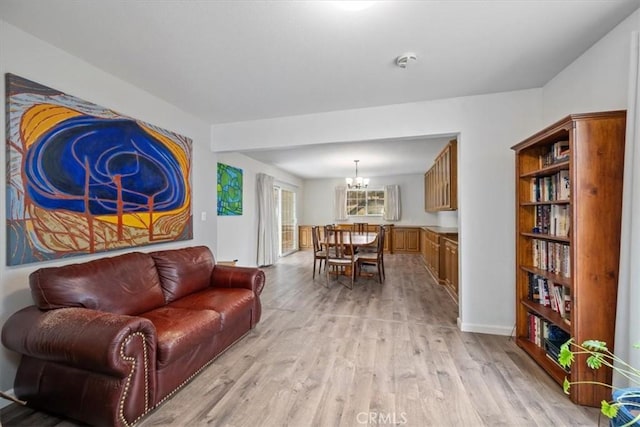 259 Saint Andrews Way, Lompoc, CA 93436 - living area with a chandelier and light wood finished floors
