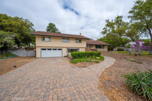 259 Saint Andrews Way, Lompoc, CA 93436 - view of front of house featuring an attached garage, decorative driveway, and a chimney