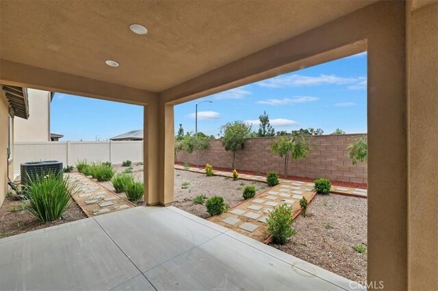 467 Daniella Way, Perris, CA 92570 - fenced backyard with a patio area and central AC unit